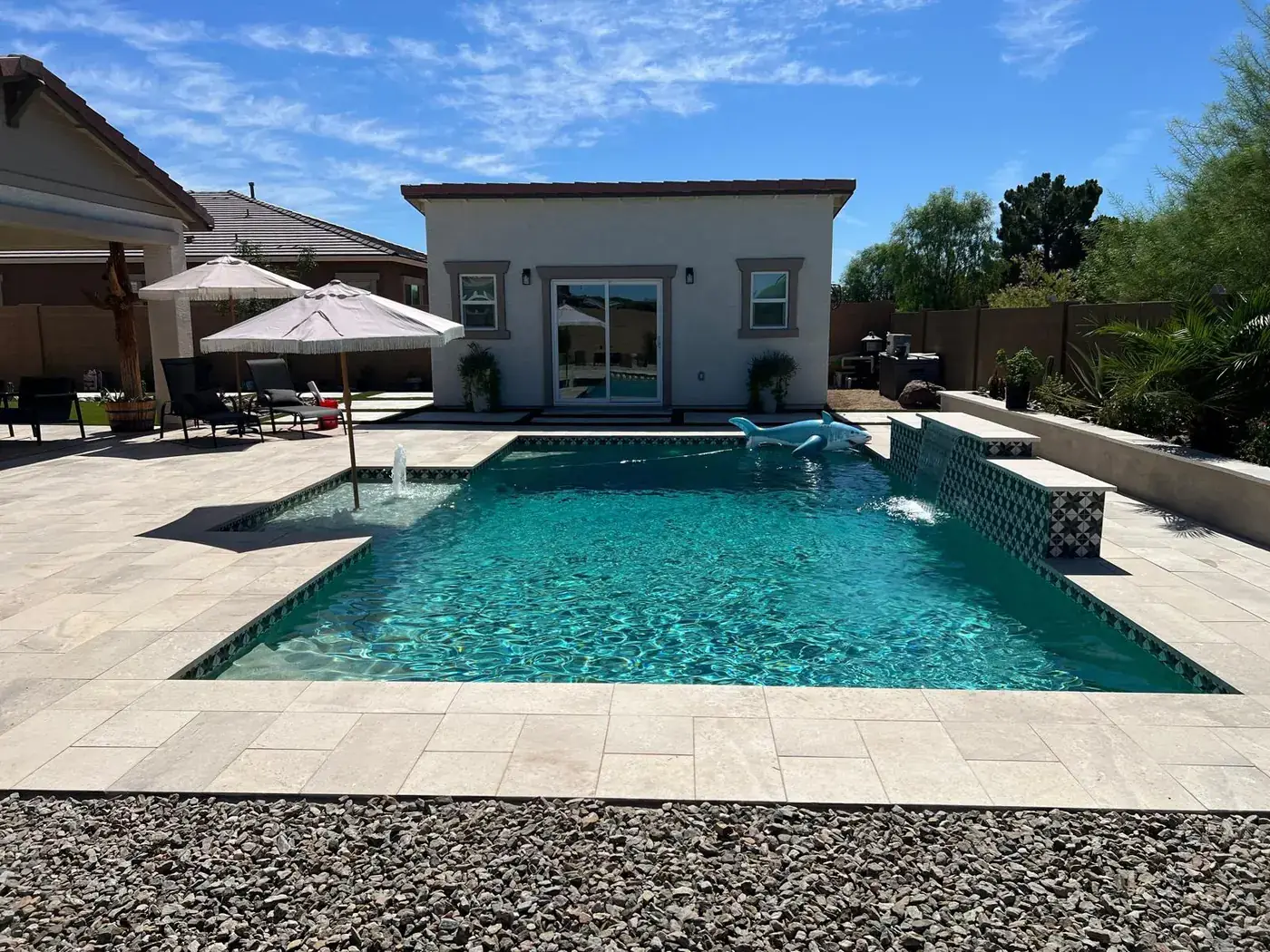 The backyard pool with the finished casita behind it.