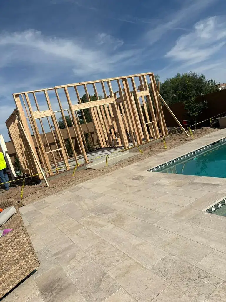 The framed walls of the casita seen at an angle from the pool deck.