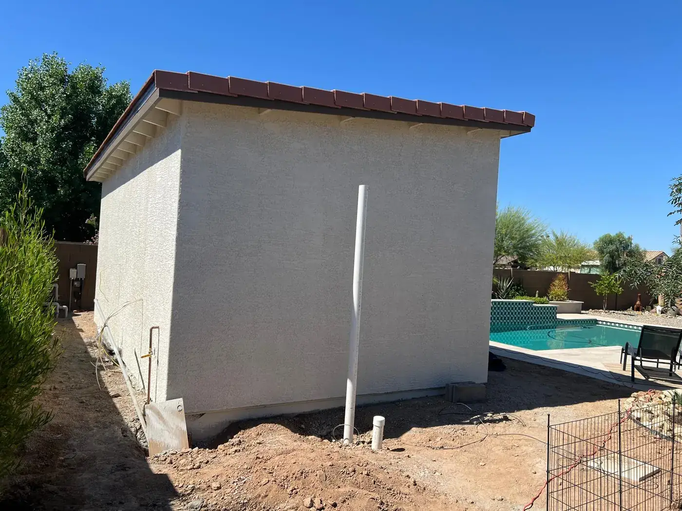 The casita with its first coats of stucco applied, seen from the side yard.